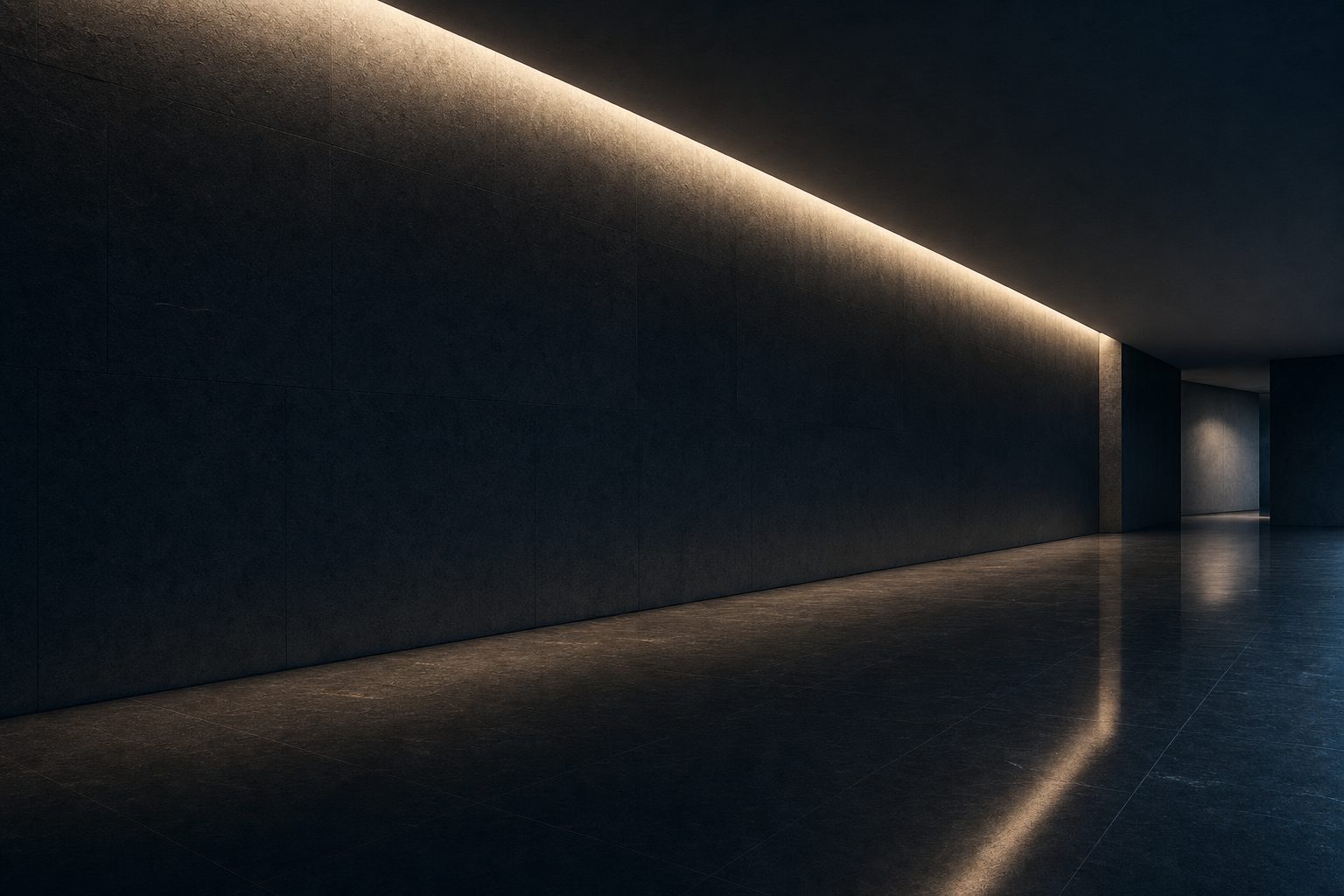 A quiet, dark stone interior lit by a single grazing line of warm light